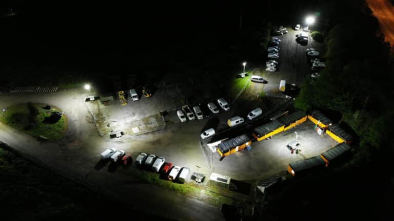 Aerial site view of prolights in car park at night